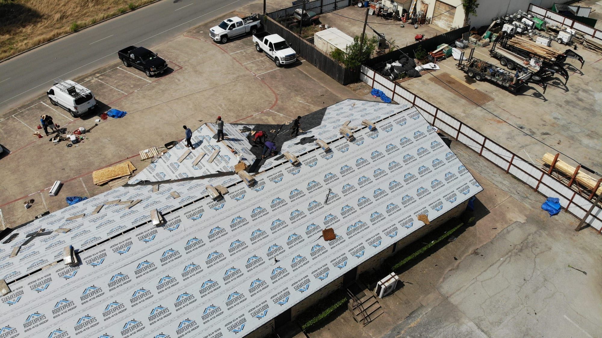 Commercial building roof with new underlayment, viewed from above