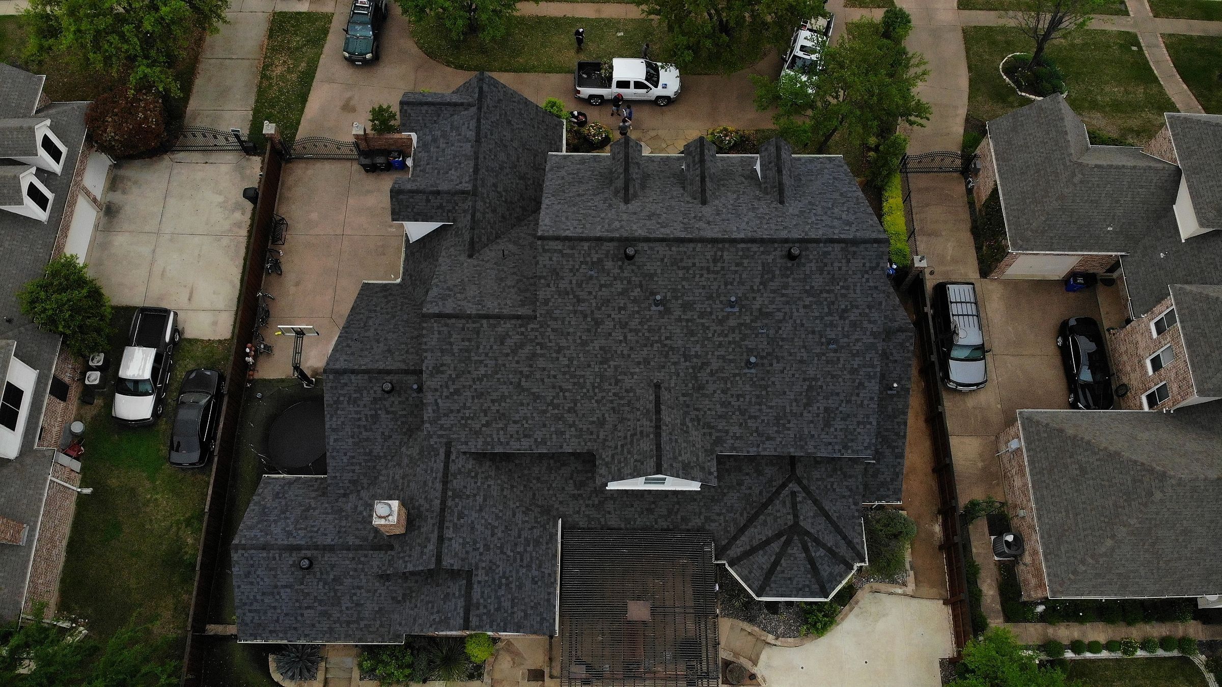 Dark architectural shingle roof on a large home in Colleyville, TX, seen from directly above